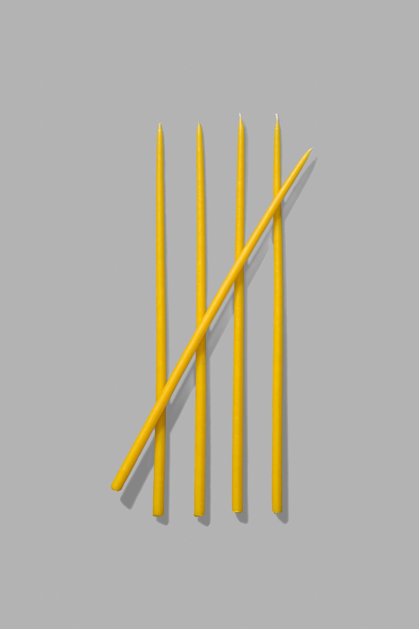 yellow thin taper candles