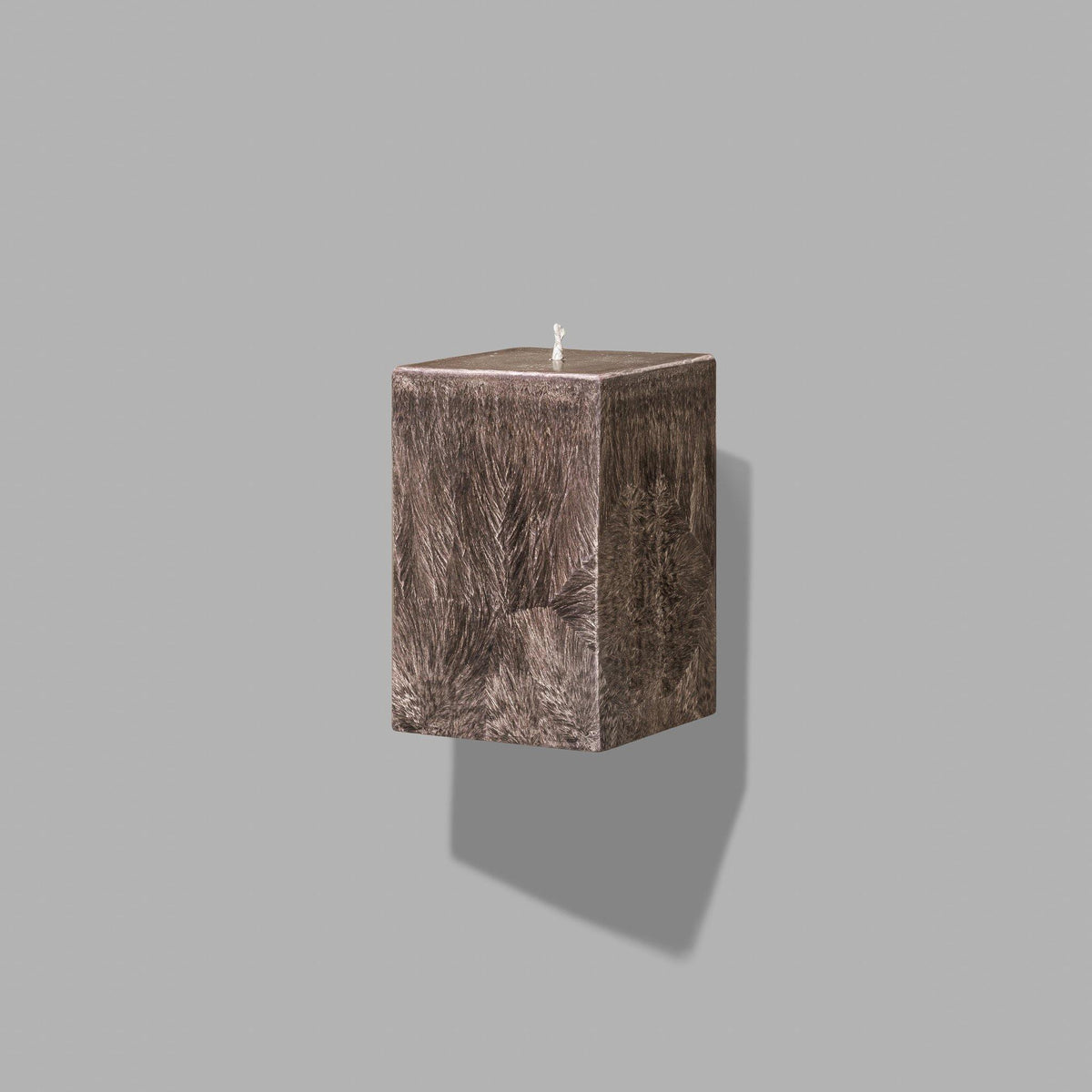 small brown square pillar candle