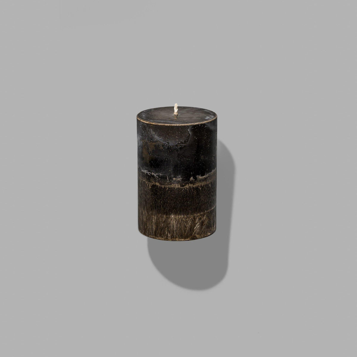 small dark brown pillar candle