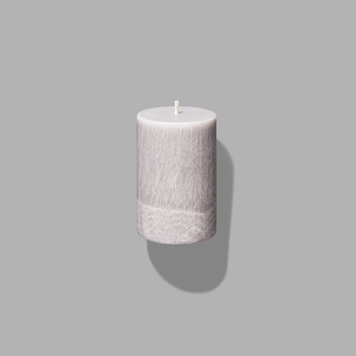 small grey pillar candle