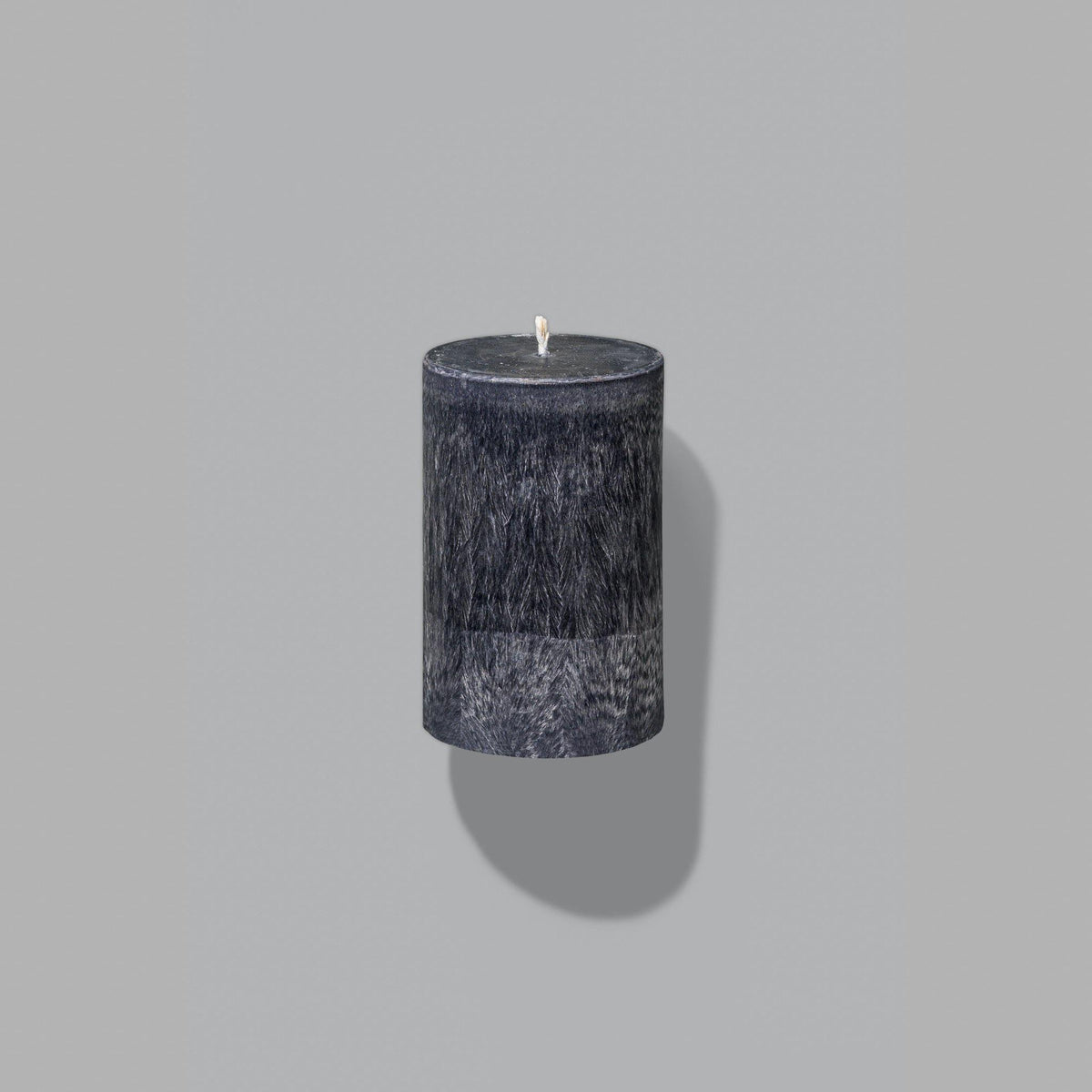 small black pillar candle