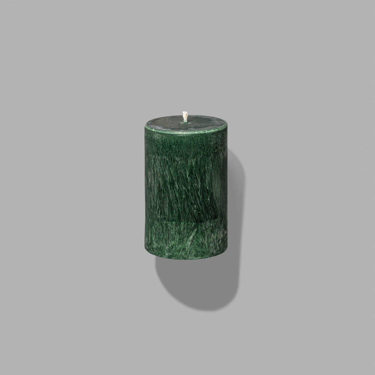 small green pillar candle