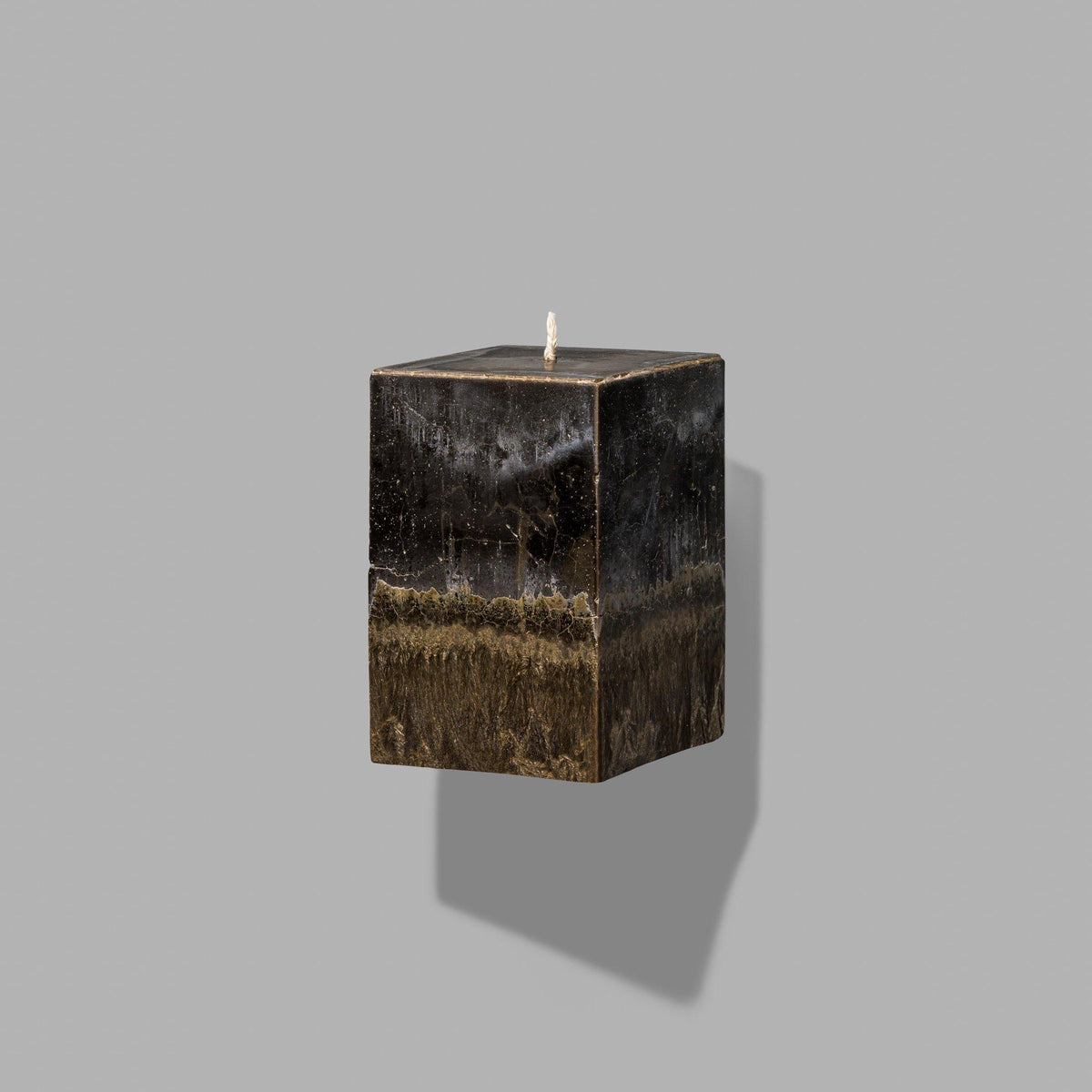 small dark brown square pillar candle