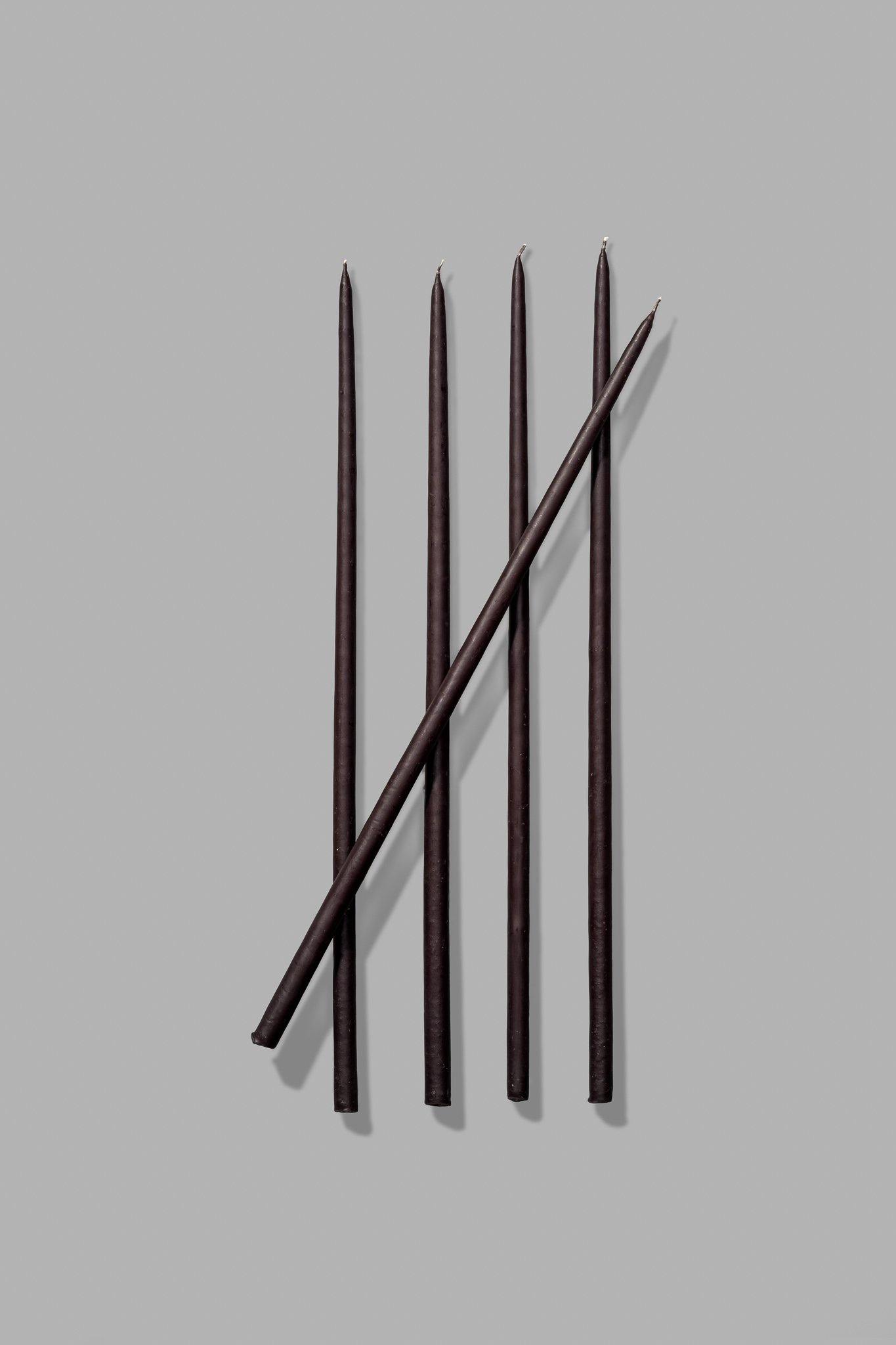 thin black taper candles