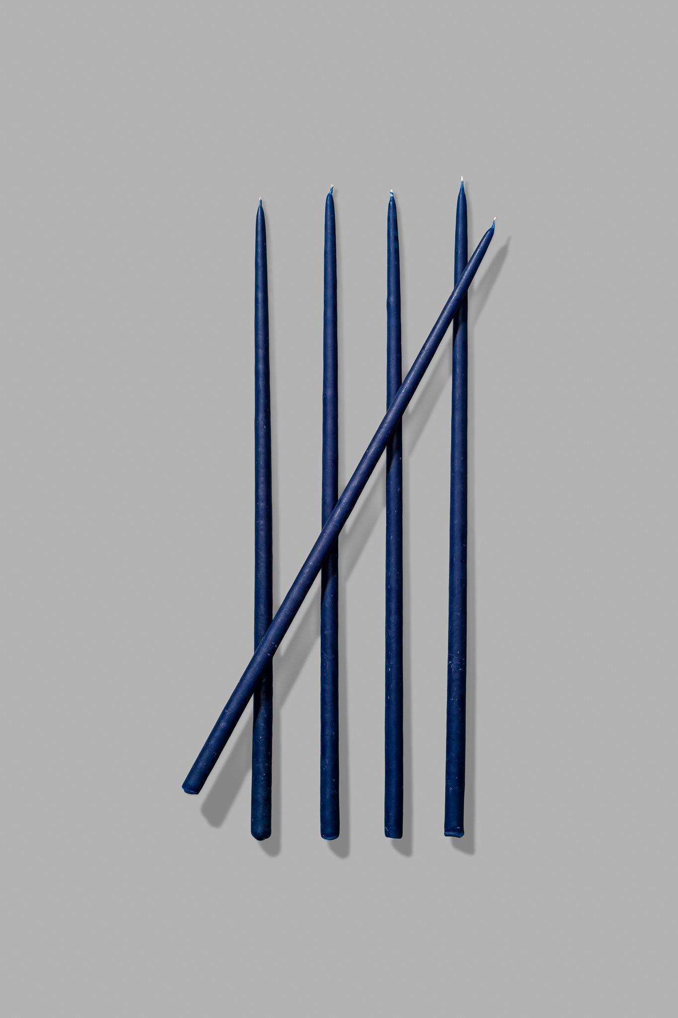 thin blue taper candles