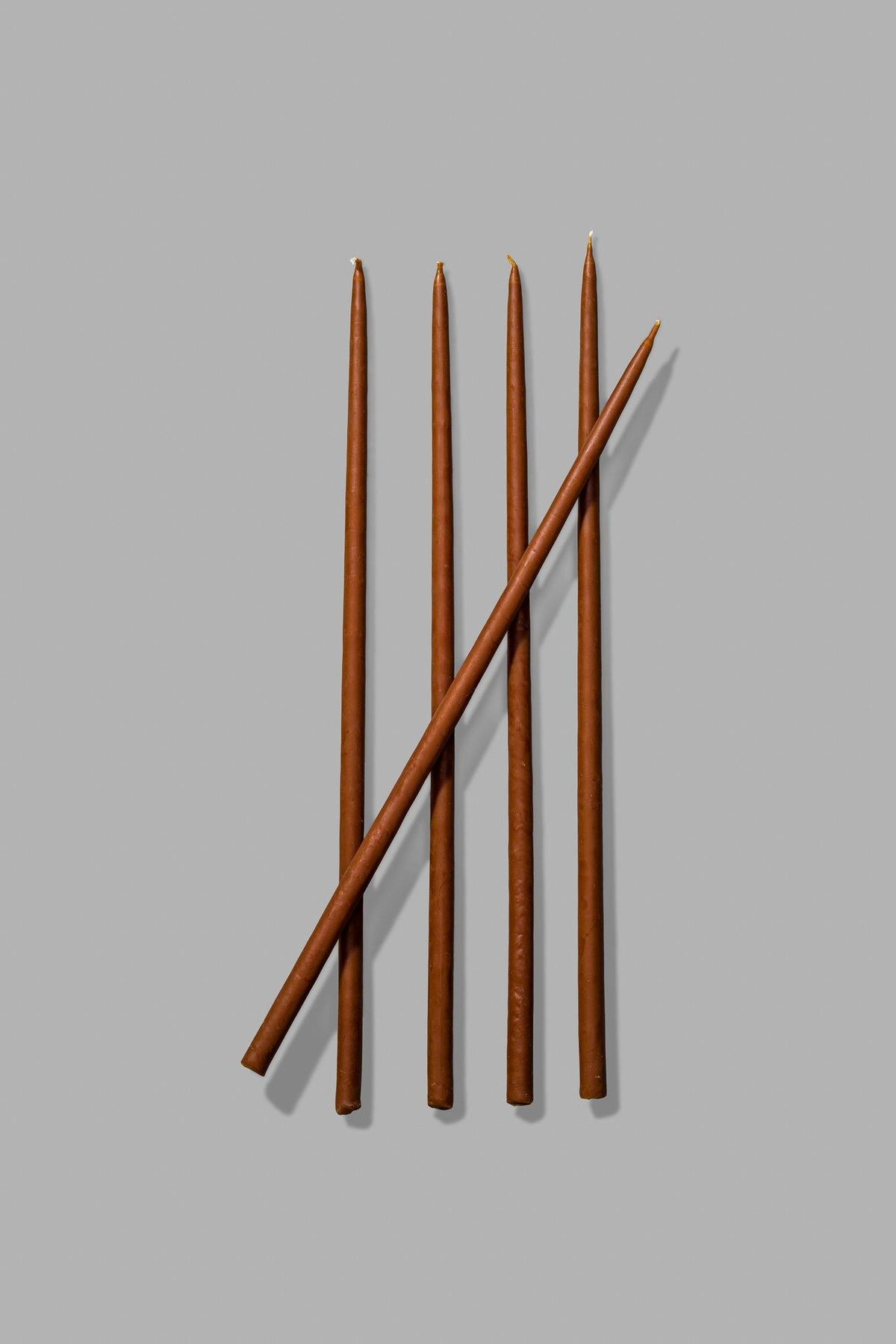 thin brown taper candles